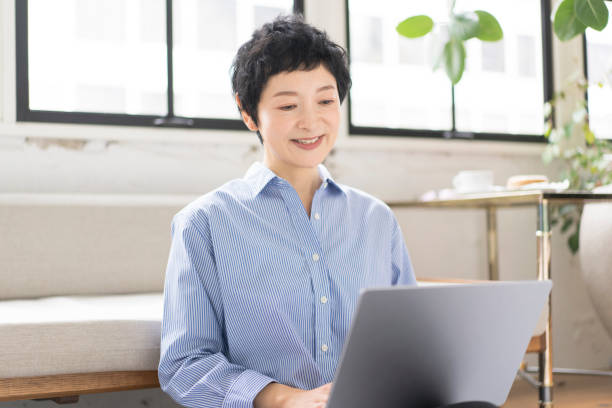 istock A middle-aged woman is working on a laptop. 1669444376
