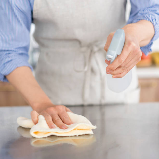 istock A woman is wiping the kitchen counter. 1669475800