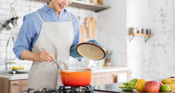 istock An Asian woman is cooking. 1669476325