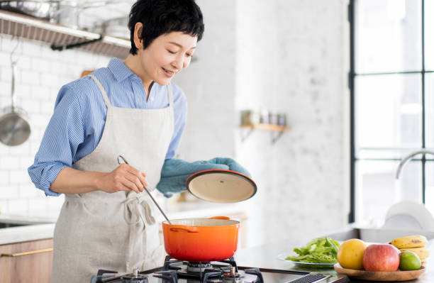 istock An Asian woman is cooking. 1669476326