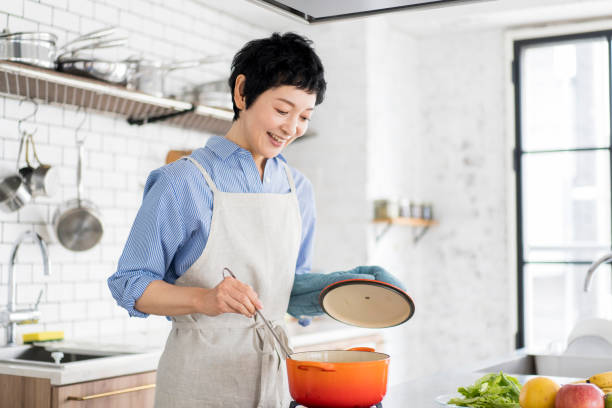 istock An Asian woman is cooking. 1669476327