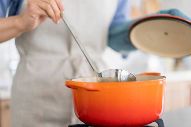 istock An Asian woman is cooking. 1669476331