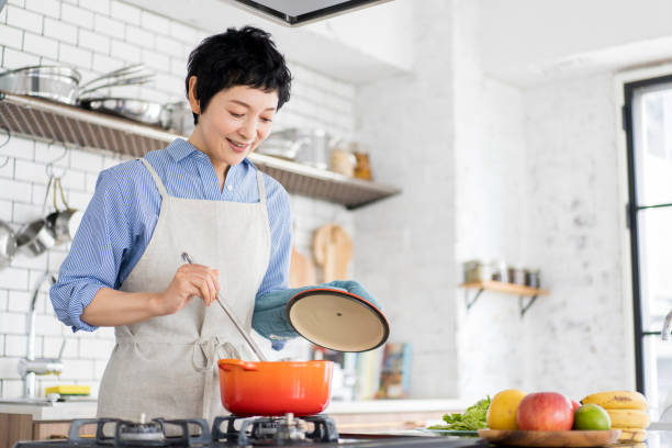 istock An Asian woman is cooking. 1669476334