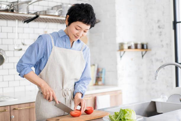 istock An Asian woman is cooking. 1669476937