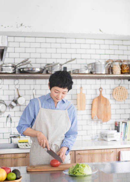 istock An Asian woman is cooking. 1669476972