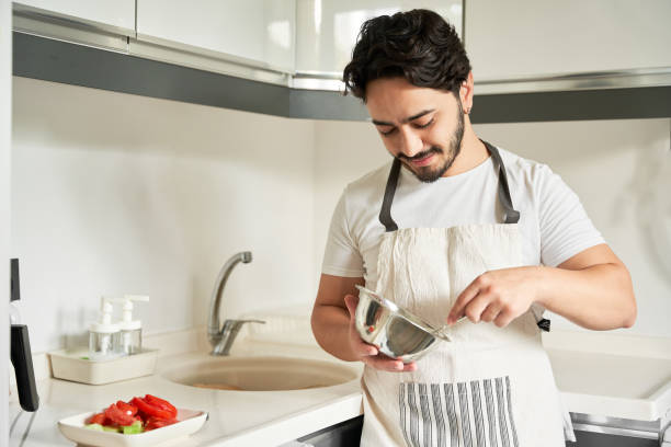 istock portrait of young man in the kitchen 1669548066