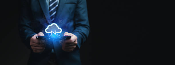 istock Individuals with cloud technology holograms, collecting data on databases on the Internet to be able to retrieve information conveniently and quickly. Cloud storage concept. 1669726476