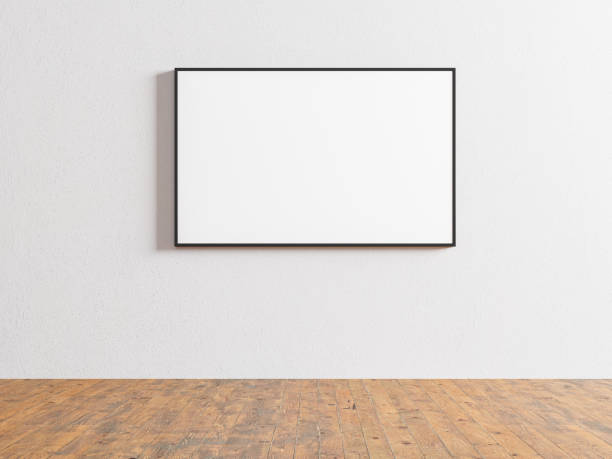 istock Wooden flooring indoors with white walls featuring empty picture frames 1669748929