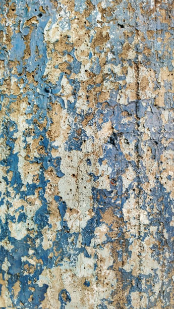 istock Grunge Old Weathered Concrete Wall With Cracked Peeled Multiple White Beige And Blue Paint Layers High Resolution Background Texture Stock Photo 1669755809