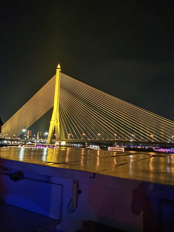 Rama VIII Bridge I took this photo while going on a boat trip.  It's very beautiful at night.