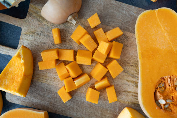 istock Diced butternut squash pumpkin. Preparing seasonal autumn fall food. 1669820084