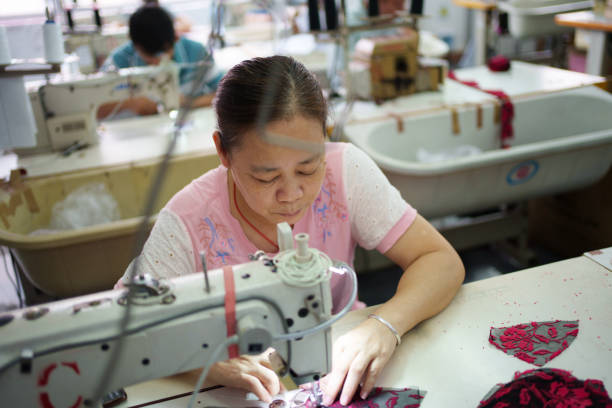 istock Female workers in small garment factory 1669830655