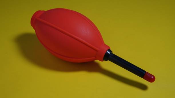 istock red silicone dust blower for cleaning camera on yellow background 1669831231
