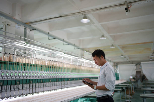istock man working in textile factory 1669835124