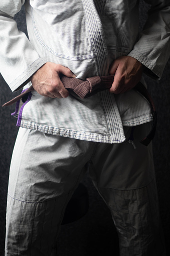 Brown belt close up on the belt martial arts backgrounds