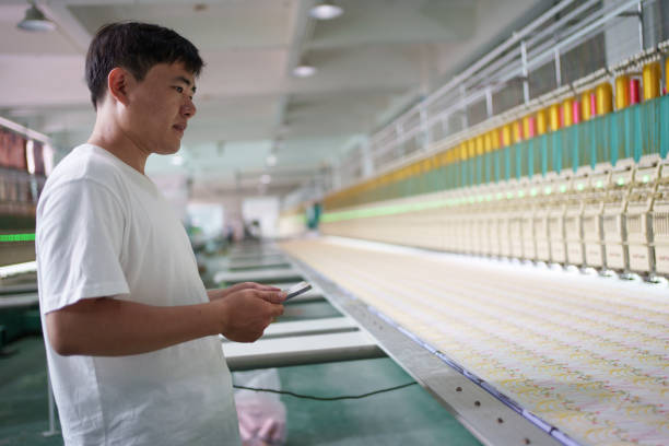 istock Skilled male worker in textile factory 1669837154