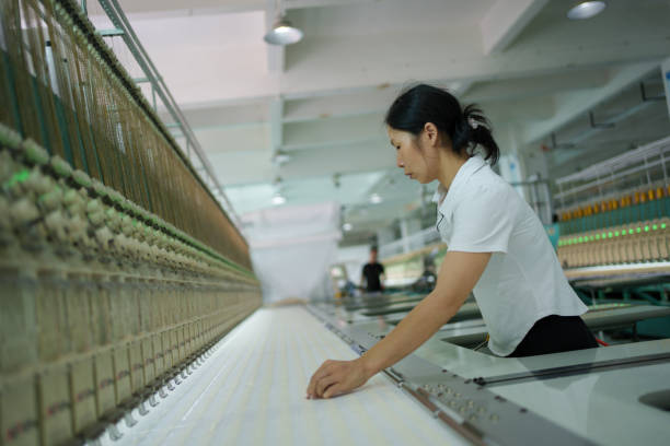 istock Female worker in textile factory 1669847318