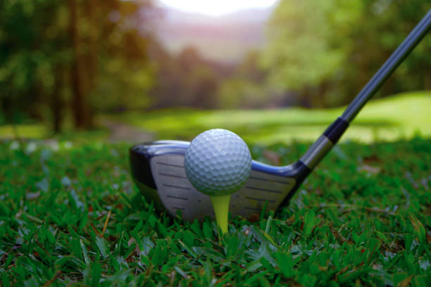 istock Golf ball and golf club in beautiful golf course at sunset background. 1669854932