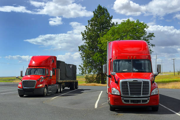 istock Two big red semi truck 1669858434