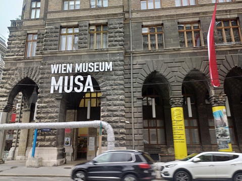 Vienna, Austria - June 8, 2023: MUSA Wien Museum with flags on Rathausstrasse Street in city center
of Vienna, Austria. Building architecture cityscape and view on road.