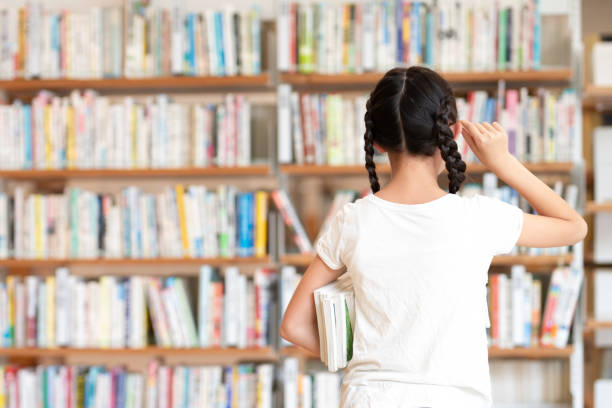 istock girl choosing a book 1669882818