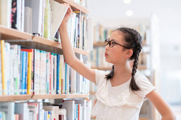 istock girl choosing a book 1669882820