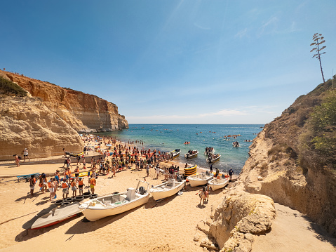 Tourism on Benagil beach in Carvoeiro, Algarve, Portugal