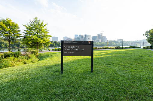 A National Park Sign at Georgetown Waterfront Park on a warm summer afternoon.