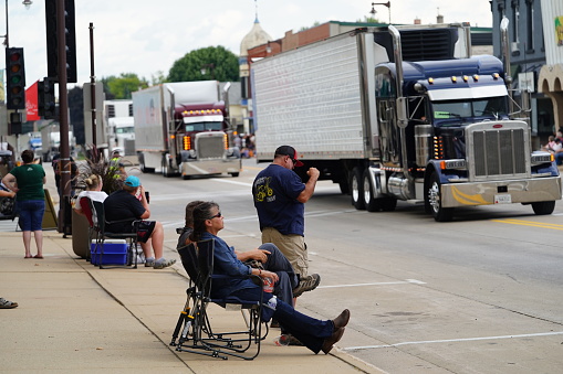 Waupun, Wisconsin USA - August 12th, 2023: Local families came out to spectate and cheer on the truckers in The Truck - n - Show parade.