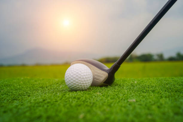 istock Golf ball and golf club in beautiful golf course at sunset background. 1669926702