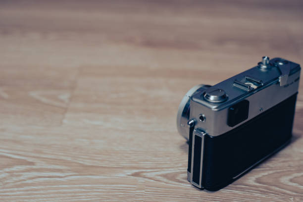 istock Vintage film camera on wood background,copyspace 1669930129