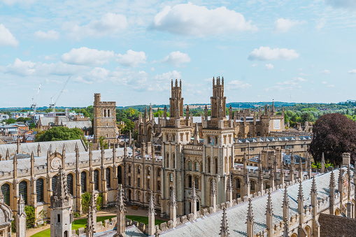 Oxford, England - June 19, 2013: Students relaxing on the grass outside Balliol College of Oxford University