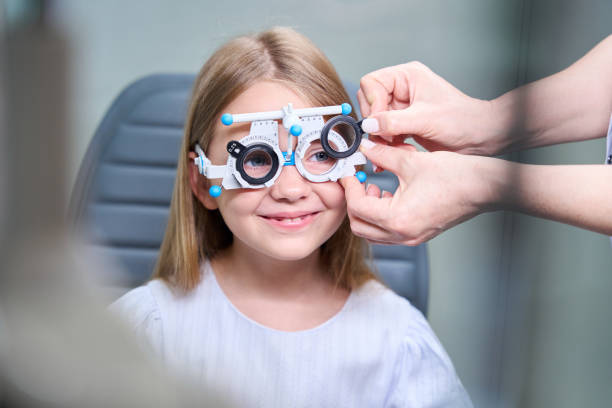 istock Qualified ophthalmologist performing subjective refraction test on child 1669935668