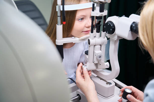 istock Qualified ophthalmologist checking child eyesight with ophthalmic equipment 1669935670