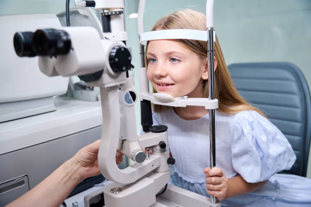 istock Child undergoing ophthalmic examination at eye clinic done by optometrist 1669936186