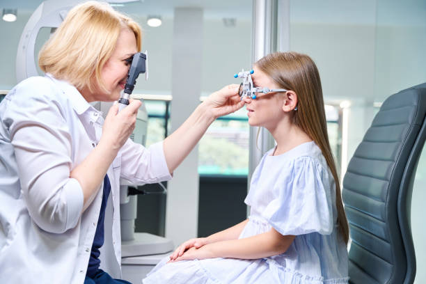 istock Focused eye doctor conducting dynamic retinoscopy on pediatric patient 1669936207