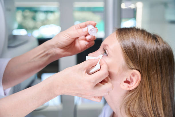 istock Qualified oculist preparing child for retinal examination 1669936251
