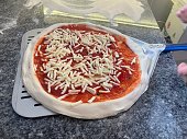 Pizzaiolo making pizza Margherita