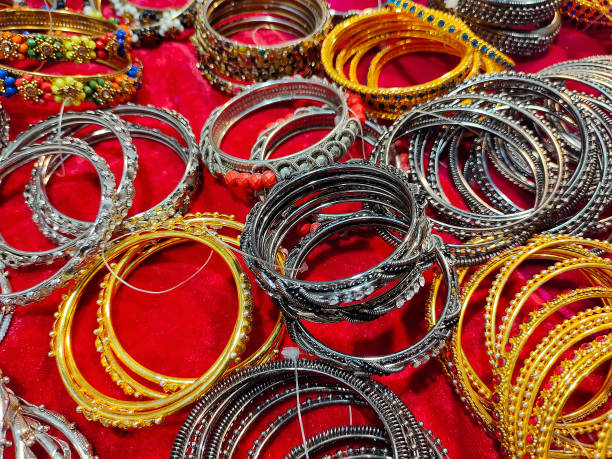istock Bangles kept for sale on red colour tabletop. Colorful bangles. 1669966468