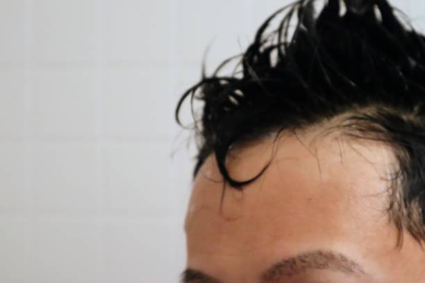 istock Close-up of a man shampooing 1669989080