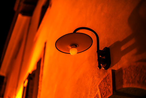 old street lamp street light on ancient wall in Malcesine on Lake Garda Verona Veneto Italy