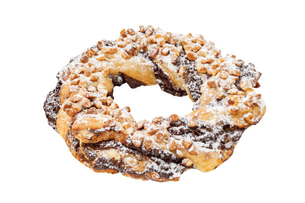 istock Puff pastry bagel donut with nuts, isolated on white background with clipping path, side view 1670028217