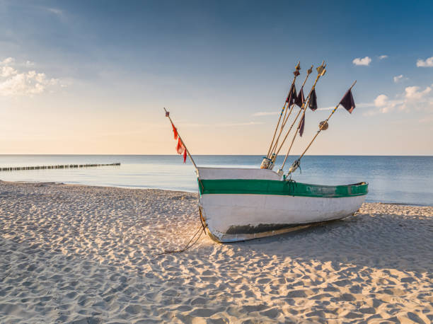 istock Fishing boat on beach by Baltic Sea in summer 1670046070