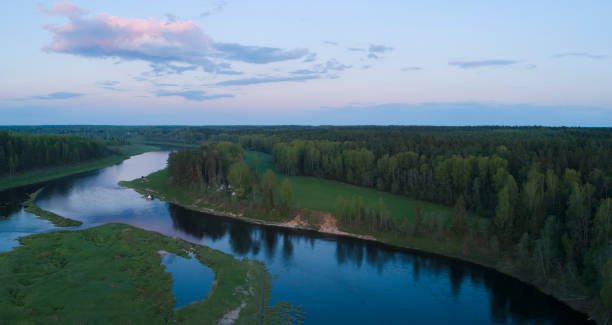 istock Aerial panoramic landscape with sunset over the river with islands and beautiful clouds on the sky. 1670053105