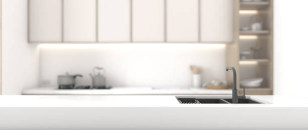 istock Kitchen interior design, modern style, white marble counter top for displaying products. Spot focus Blurred kitchen background. 3D rendering 1670059565