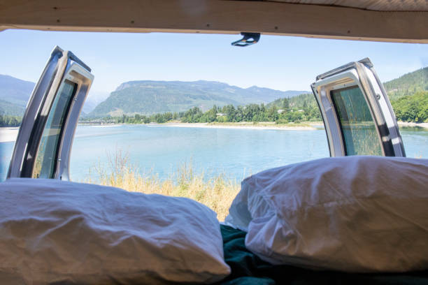 istock View past bed and camper van doors to lake 1670062206