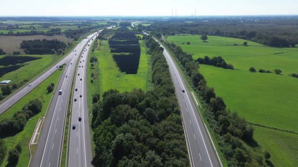 istock Aerial view on the A7 motorway in northern Germany between fields and meadows. 1670145508