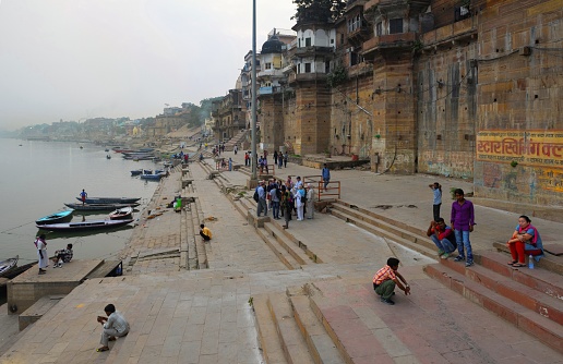 Varanasi, India, November 22, 2015: View of a ghat on the Ganges River in the holy city of Varanasi.