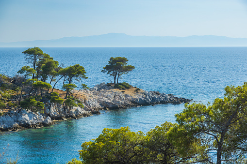 Amarandos cove Three trees (Mamma Mia!), Skopelos island, Sporades, Greece at sunset.