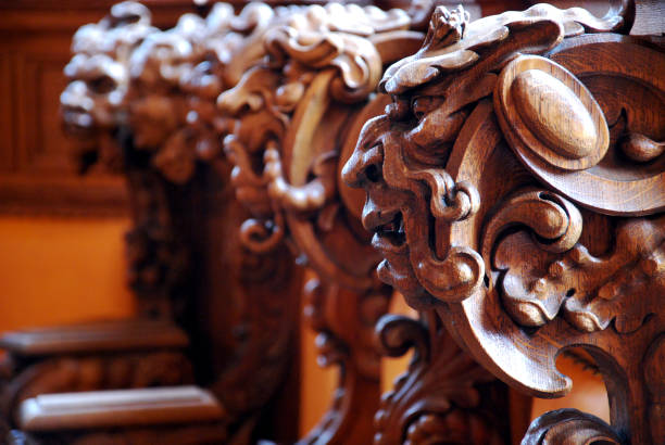 Within Bremen's venerable Town Hall (Rathaus), timeless oak seats cradle the enchanting visages of mythical beings. These meticulously carved faces, silent yet evocative, hold the secrets of centuries within the hallowed senate chamber, where history and artistry unite.